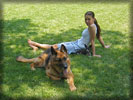 Alyssa Milano with Dogs on the Grass