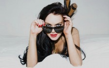 Lindsay Lohan on the Bed, Sunglasses