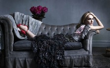 Natalie Portman lying down on the Sofa