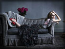Natalie Portman lying down on the Sofa