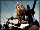 Shakira on a Motorbike