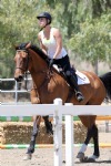 Kaley Cuoco riding a Horse