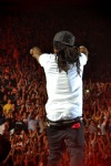 Lil Wayne on the Stage, a Crowd of Cheering Fans