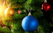 Blue Christmas Bauble on a Pine Tree