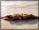 Laetitia Casta in Bikini on the Beach